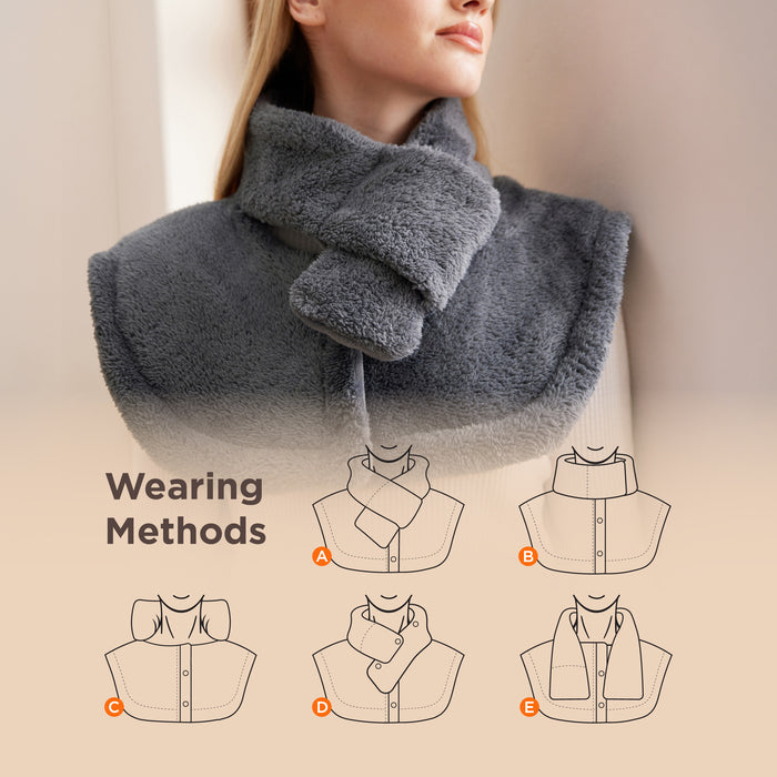 Smart heating pad in grey faux cashmere, demonstrating 5 adjustable neck and shoulder wearing styles.
