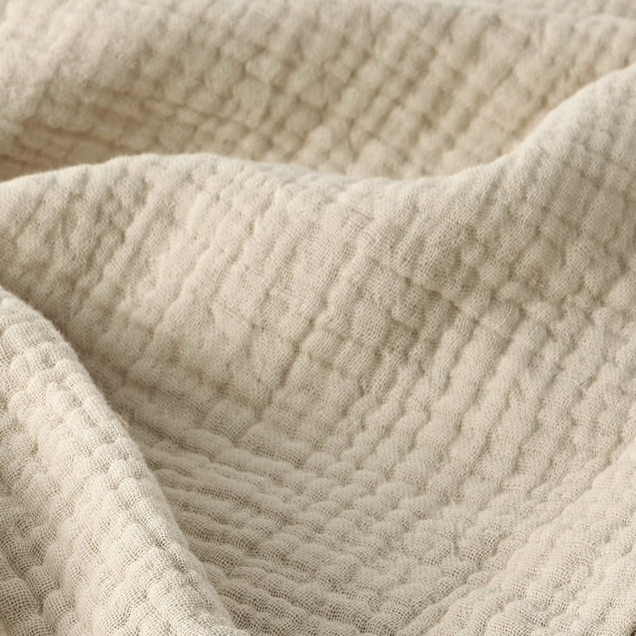 Close up of GentleSoft 100% cotton gauze blanket texture, showing breathable four-layer weave.