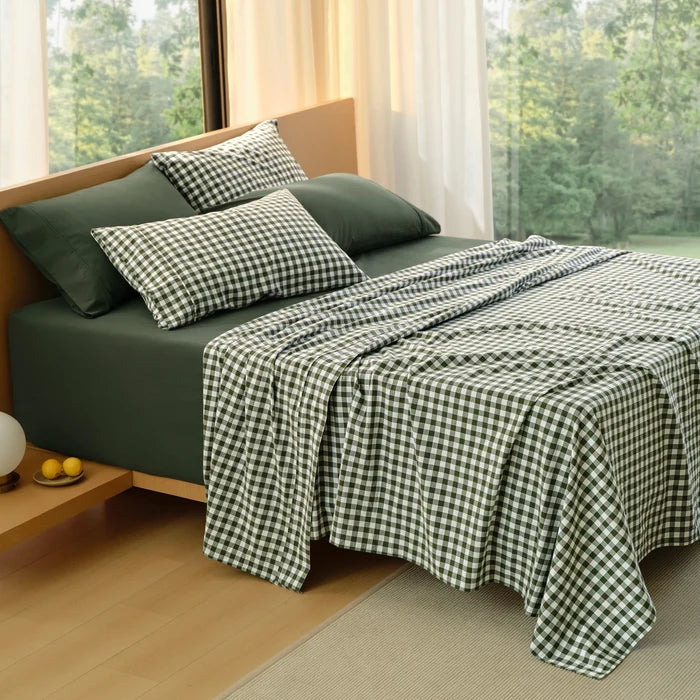 PureWoven™ 6-piece dark green washed cotton sheet set with gingham pillowcases.