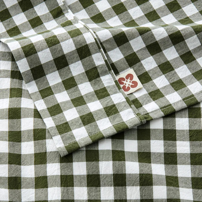 PureWoven green gingham washed cotton sheet set fabric, close-up with tag.