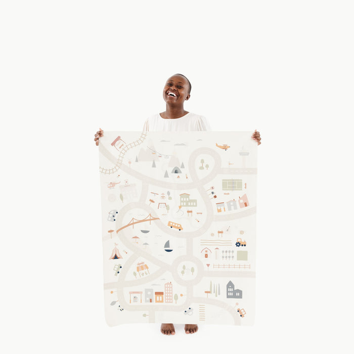 Boulevard@Woman holding the Boulevard Mini+ Mat