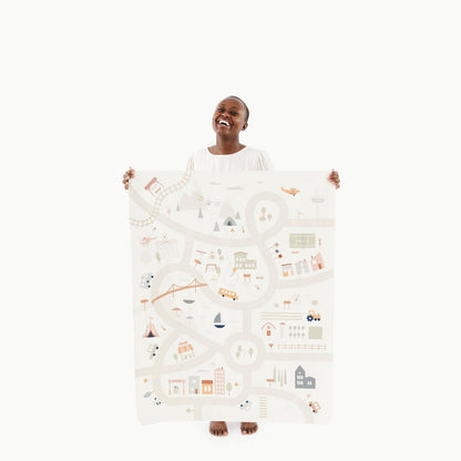 Boulevard@Woman holding the Boulevard Mini+ Mat