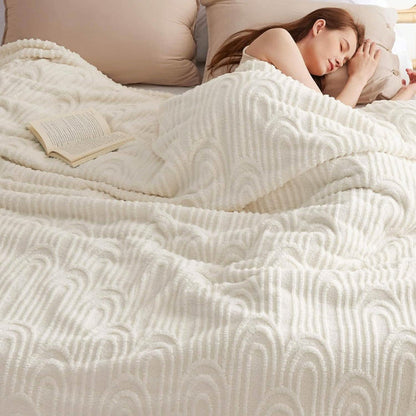 GentleSoft Arch Sherpa Fleece Blanket in cream, plush texture with raised arch pattern, woman sleeping on bed.