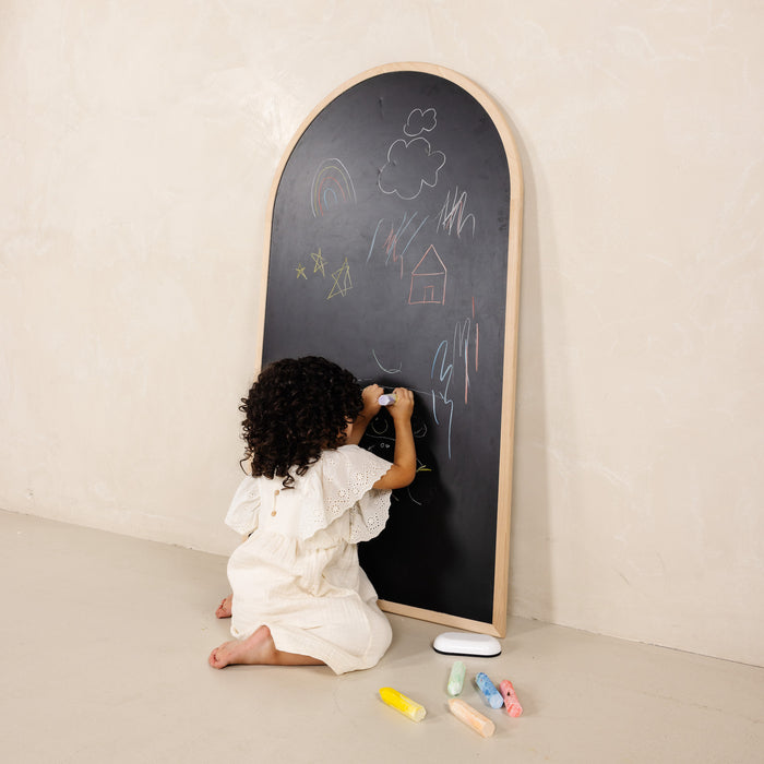 Beech@Child using a kids chalkboard for drawing and magnetic play at home