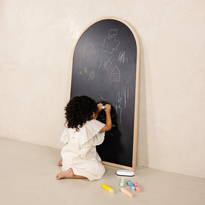 Beech@Child using a kids chalkboard for drawing and magnetic play at home