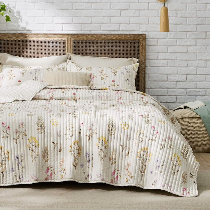 Autumn Wildflower Quilt Set with delicate floral print on cream polyester fabric, featuring channel stitching.