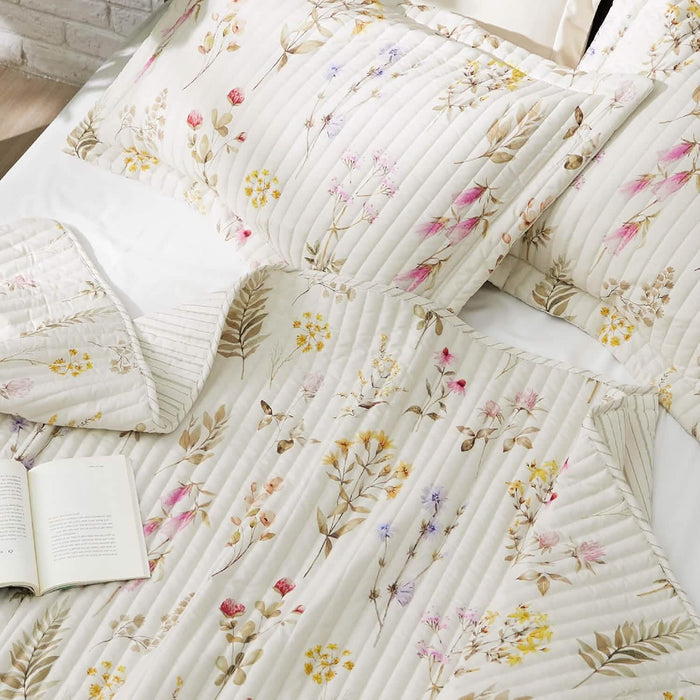 Autumn Wildflower Quilt Set, white bedding with delicate floral pattern and quilted detail.