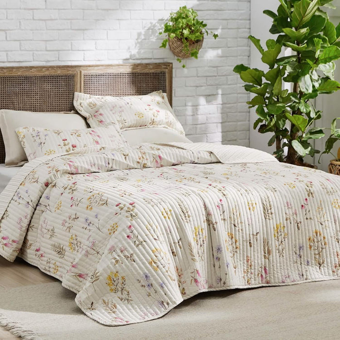 Cream quilt set with delicate autumn wildflowers and quilted stitching.