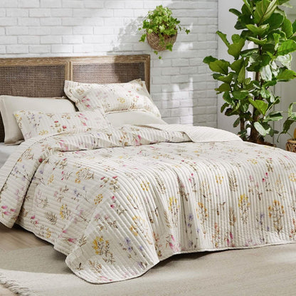 Cream quilt set with delicate autumn wildflowers and quilted stitching.