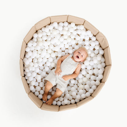 Millet@Child playing in a soft ball pit designed for babies and toddlers