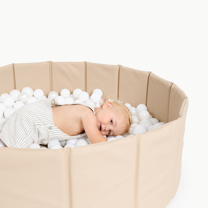 Millet@Close up of kid playing in the Millet Ball Pit