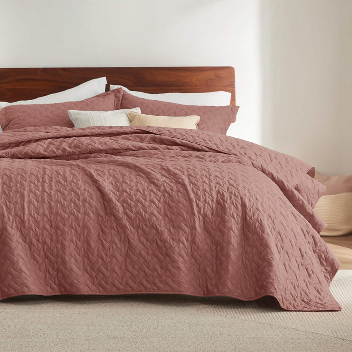 GentleSoft rose basket-weave quilt set on bed with shams, showcasing soft polyester microfiber texture.