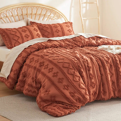 GentleSoft boho burnt orange comforter set with embroidered diamond and line patterns on a bed.