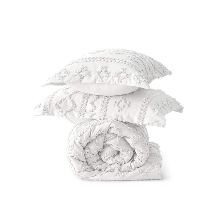 White boho comforter set with diamond and line embroidery, includes rolled comforter and two shams. Soft microfiber texture.