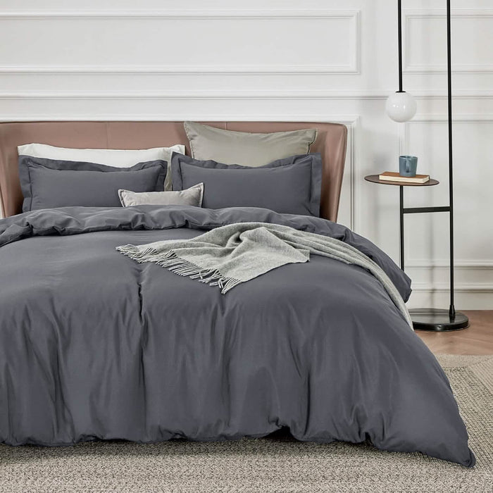 Dark gray GentleSoft microfiber duvet cover set with shams and throw blanket on a bed.