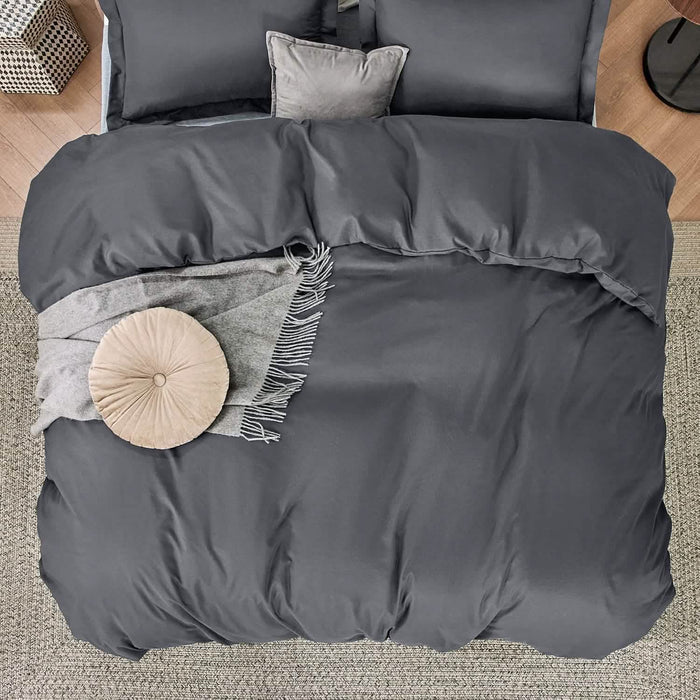 Charcoal gray GentleSoft microfiber duvet cover set with shams, throw blanket, and decorative pillows on a bed.