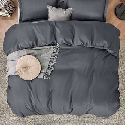 Charcoal gray GentleSoft microfiber duvet cover set with shams, throw blanket, and decorative pillows on a bed.