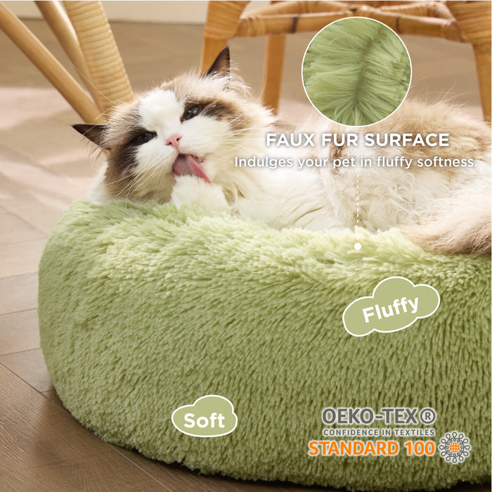 Fluffy Ragdoll cat relaxing in a light green donut pet bed, showcasing soft faux fur and OEKO-TEX certification.