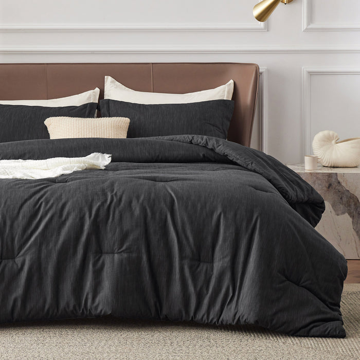 GentleSoft charcoal gray comforter set with subtle dual-tone texture, plush microfiber for all-season comfort.