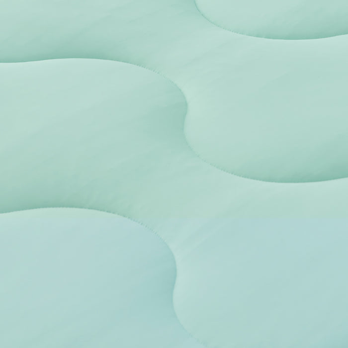 GentleSoft Cooling Comforter Set close-up: mint green fabric with wave quilting showing soft, smooth texture.