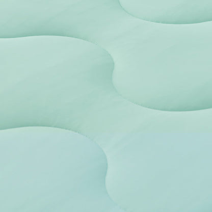 GentleSoft Cooling Comforter Set close-up: mint green fabric with wave quilting showing soft, smooth texture.