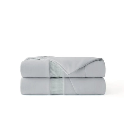 Cooloxy Breathable Cooling Comforter folded, featuring soft textured fabric and perforated ventilation band.