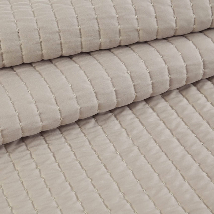 GentleSoft beige quilt detail: plush microfiber and channel stitching texture.