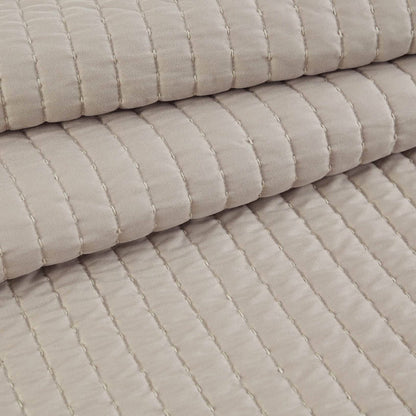 GentleSoft beige quilt detail: plush microfiber and channel stitching texture.