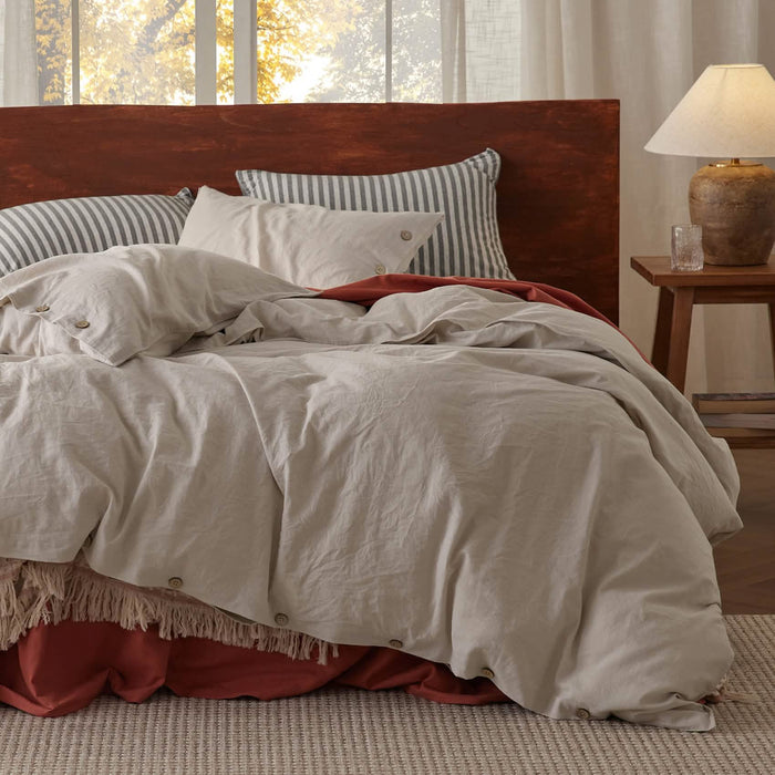 GentleSoft Cotton Linen Hybrid Duvet Cover Set in light beige with relaxed texture and button closures on a cozy bed.