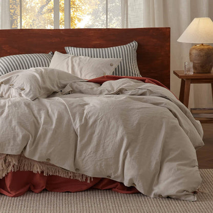 GentleSoft Cotton Linen Hybrid Duvet Cover Set in light beige with relaxed texture and button closures on a cozy bed.