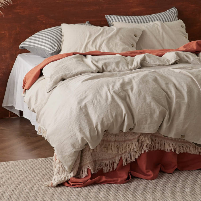 GentleSoft Cotton Linen Duvet Cover Set in light beige with relaxed texture and button closures on a cozy bed.