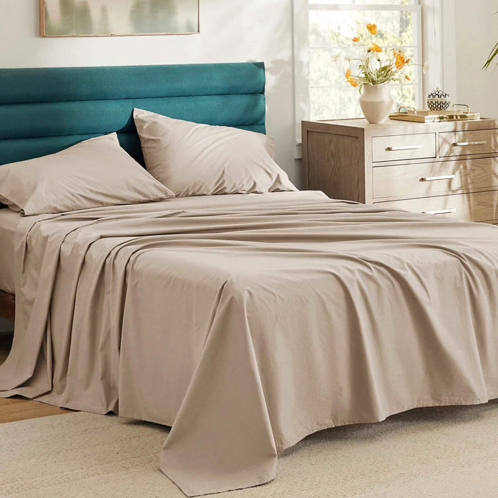 Taupe GentleSoft Cotton Percale sheet set on a made bed. Soft, breathable, skin-friendly texture.