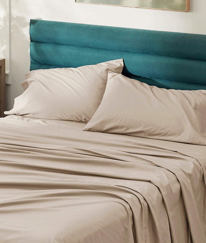 Taupe GentleSoft Cotton Percale sheet set on a made bed, showcasing breathable, skin-friendly texture.
