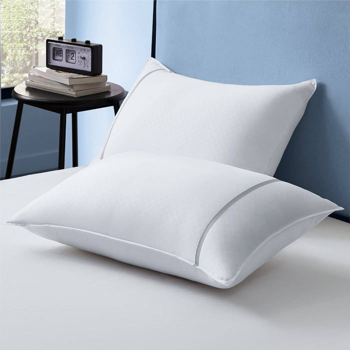 GentleSoft Diamond Pattern Pillows 2pk, white hotel blend luxury pillows with diamond pattern and gray piping on bed.