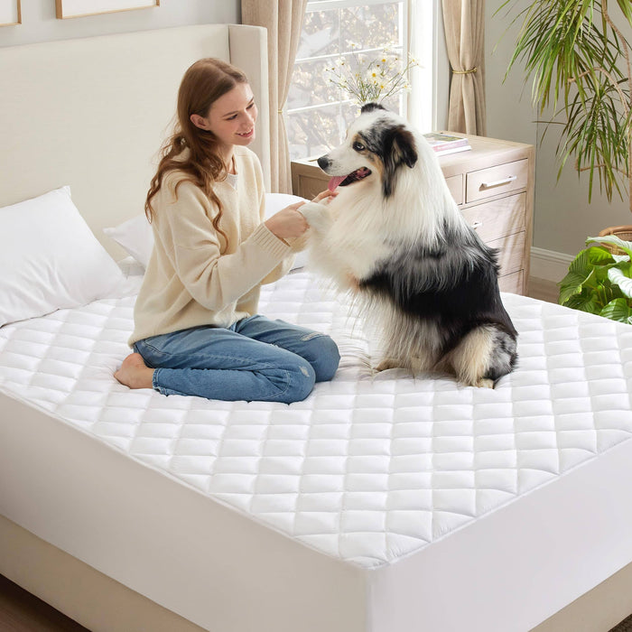 Woman and dog on GentleSoft diamond quilted waterproof mattress pad, showcasing comfort and protection for home settings.