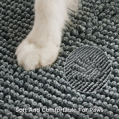 Close-up of a white dog paw on a textured gray chenille dog doormat, emphasizing soft comfort.