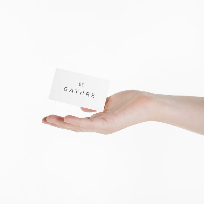 All@woman holding a gift card