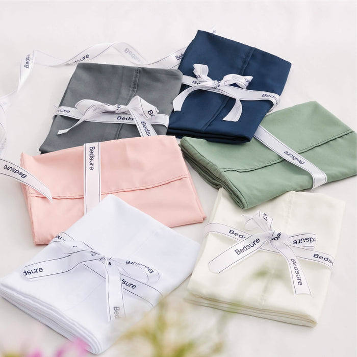 GentleSoft microfiber pillowcases in navy, grey, pink, sage green, white, cream. Tied with Bedsure ribbon. Packaging.