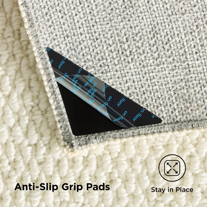 Faux wool area rug underside with anti-slip grip pads; stays in place securely.