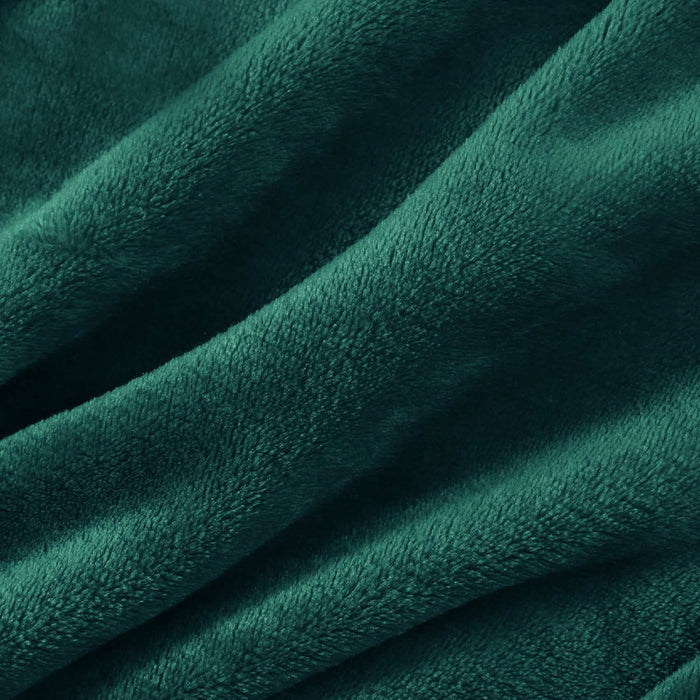Close-up of forest green GentleSoft flannel fleece blanket texture. Plush, soft fabric with subtle folds.