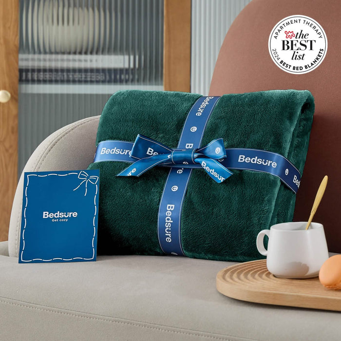 Forest green GentleSoft flannel fleece blanket tied with blue Bedsure ribbon, gift-ready for any occasion.