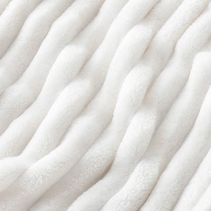 Off-white GentleSoft® plush polyester blanket with ribbed texture.