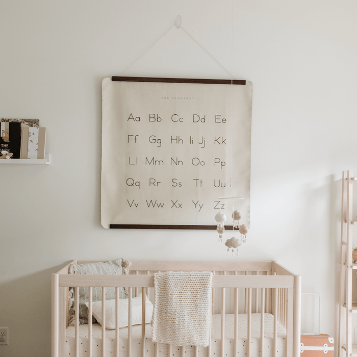 Alphabet@Alphabet Mini Mat hanging on wall above crib