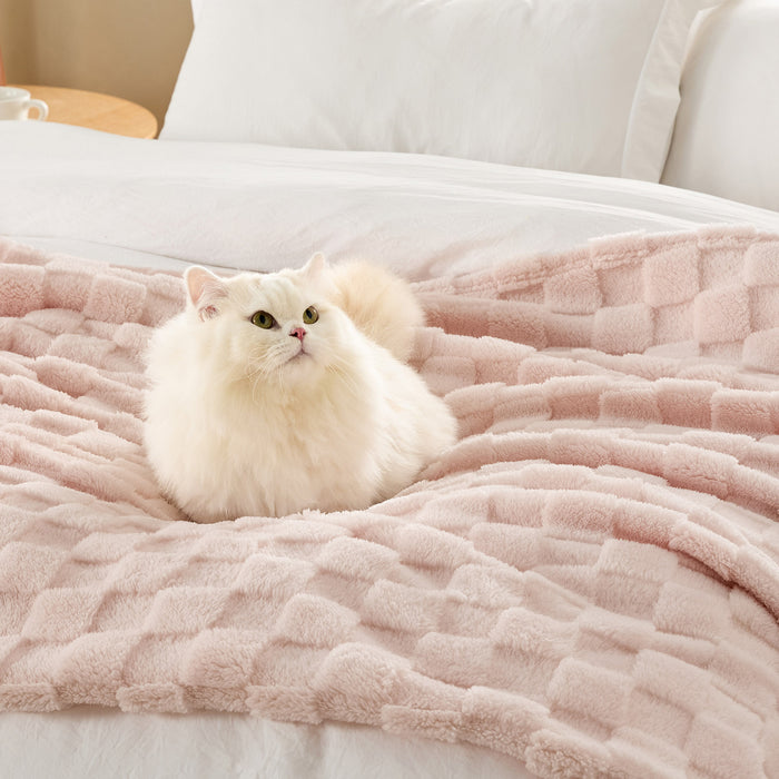 GentleSoft Jacquard Shaggy Sherpa Blanket light pink with fluffy white cat on bed, showing plush texture.