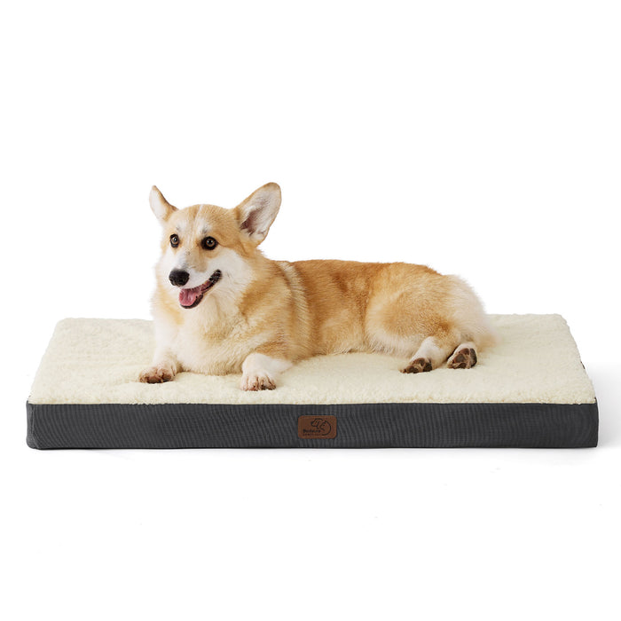 Large orthopedic dog bed with cream Sherpa top and gray corduroy base, featuring a Corgi dog relaxing comfortably.