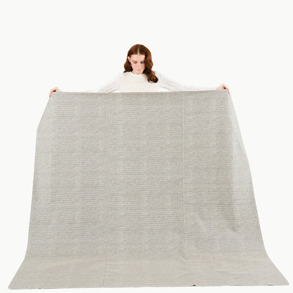Stone Stripe / Square@Woman holding the Stone Stripe Maxi Mat
