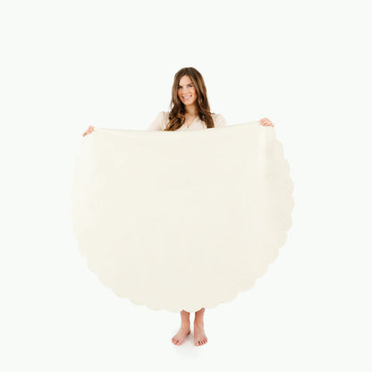 Ivory Scallop / Circle@Woman holding the Ivory Scallop Circle Midi Mat