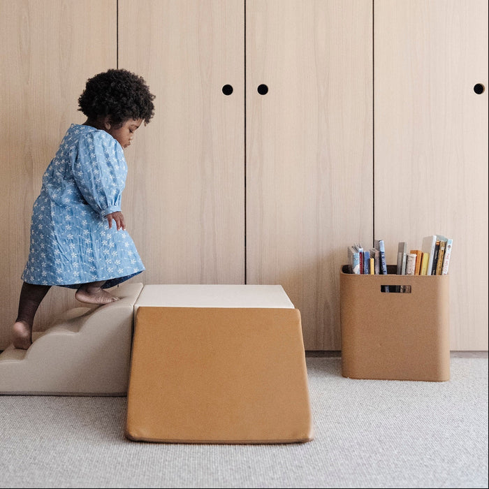 kid playing on the mini climber playset