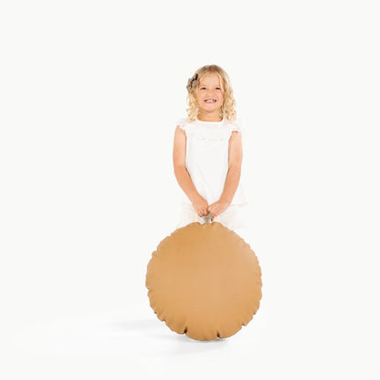 Camel / Circle@little girl holding the Camel Mini Circle Floor Cushion