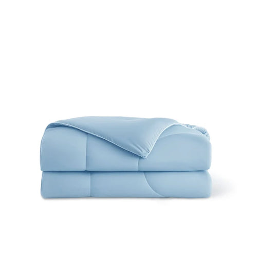 Folded light blue Nylon Comforter, soft texture, quilted design, ideal for cooling.